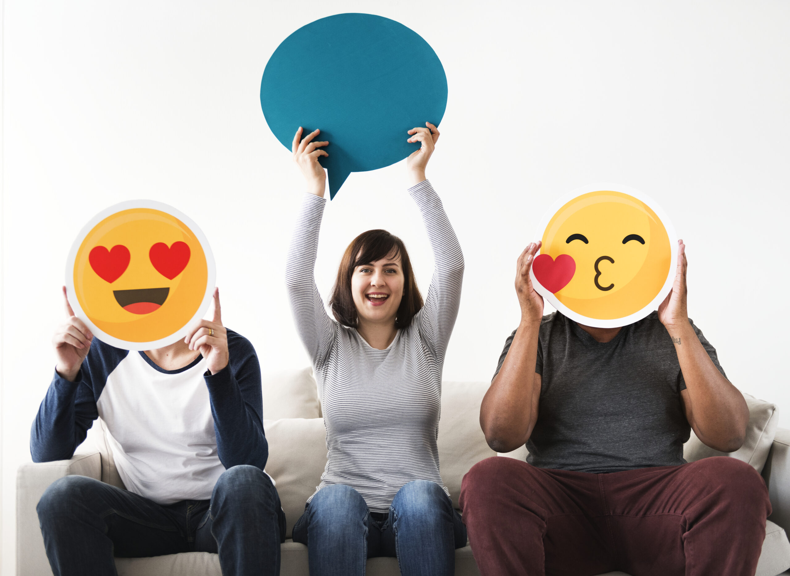 group-of-diverse-friends-sitting-on-couch-with-PLXKTYV